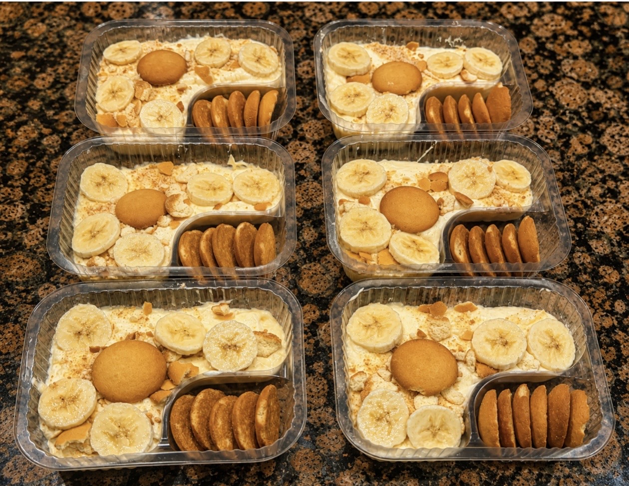 Trays of Campus Cravings banana pudding topped with banana slices and vanilla wafers